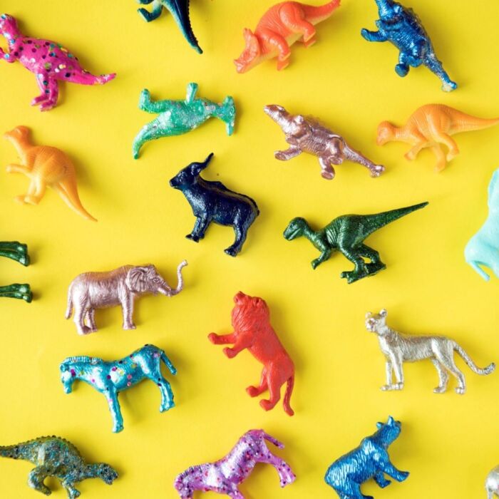 Various animal toy figures colorful background 2